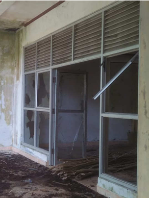 3D rendering of modern high-rise building with glass façade and complex geometric shapes